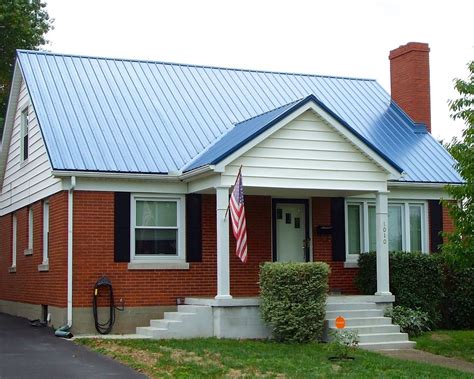 blue house red metal roof|blue houses with metal roofs.